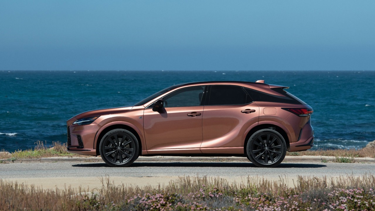 A Lexus RX 450h+ parked outside a building