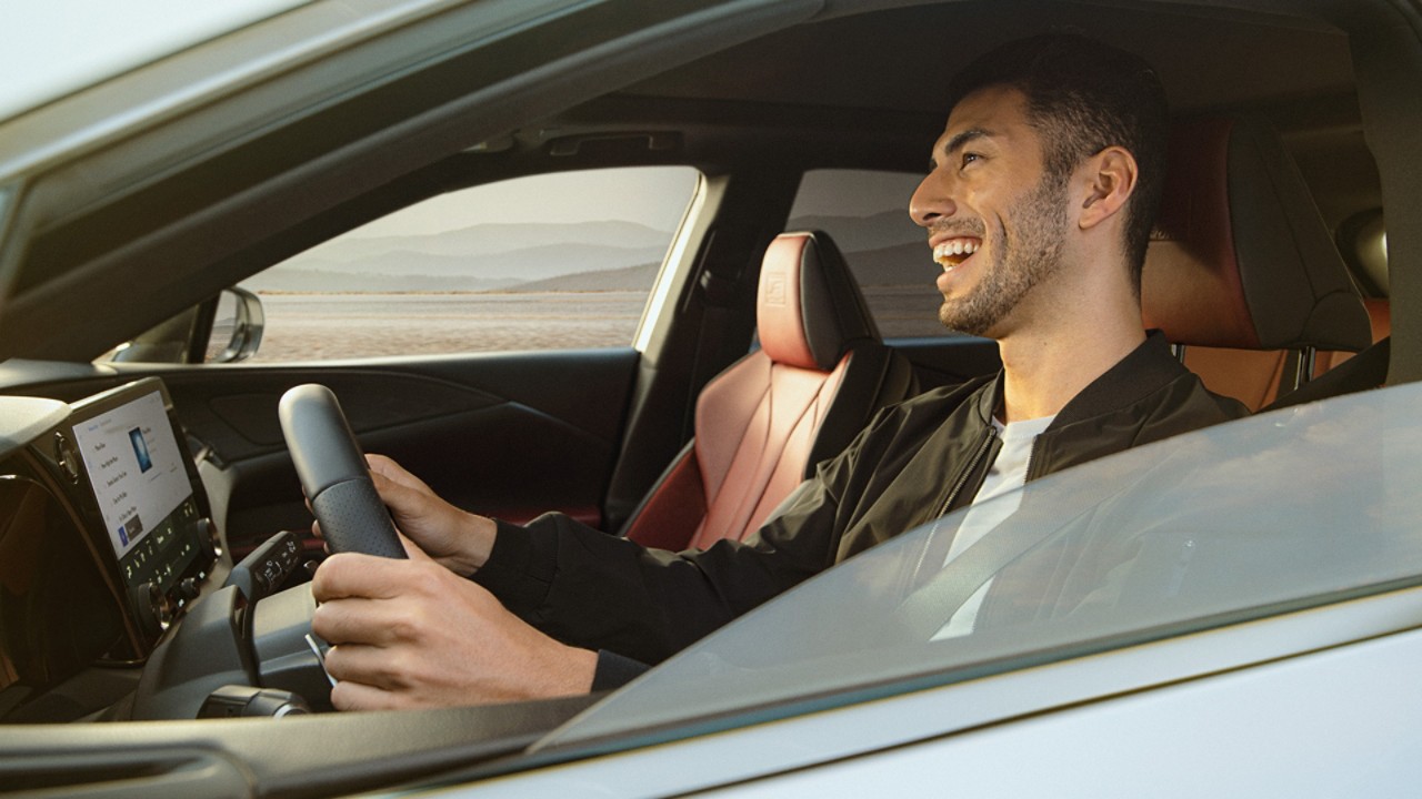 A man driving a Lexus RX