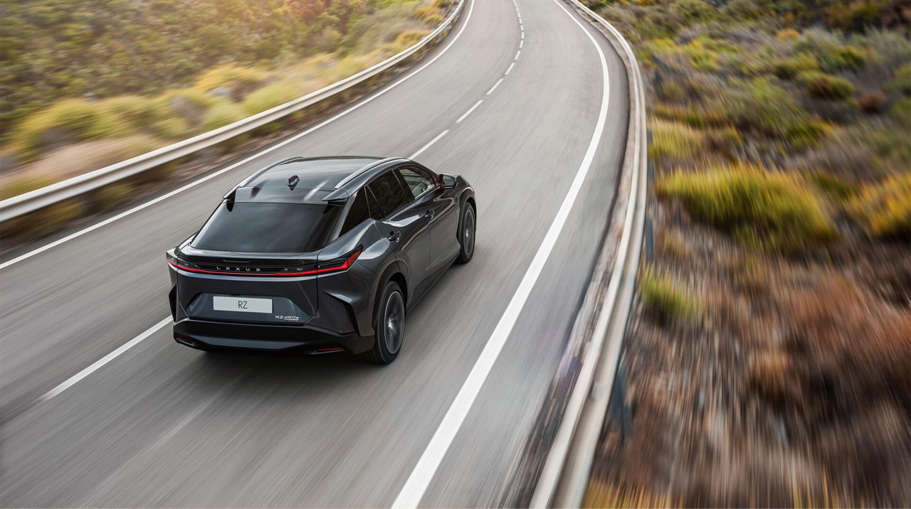 Rear view of the Lexus RZ 450e driving