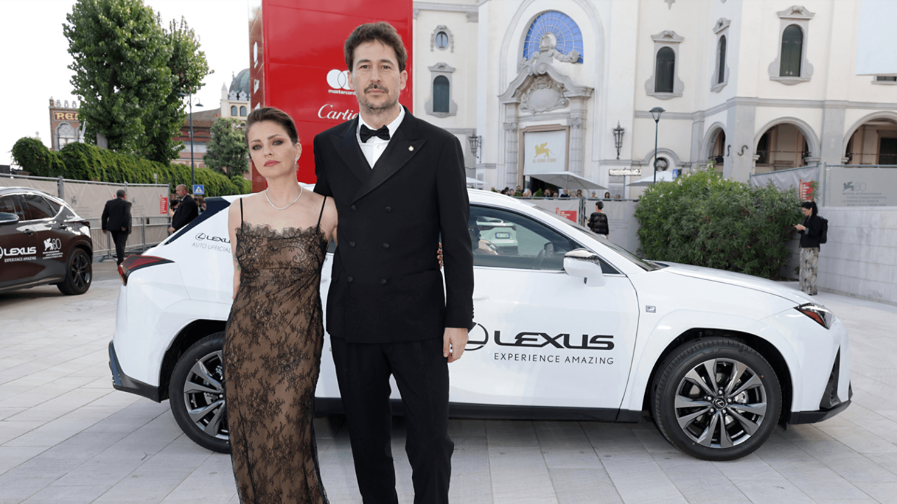 Dolores Fonzi and Santiago Mitre stood in front a Lexus at the Venice Film Festival