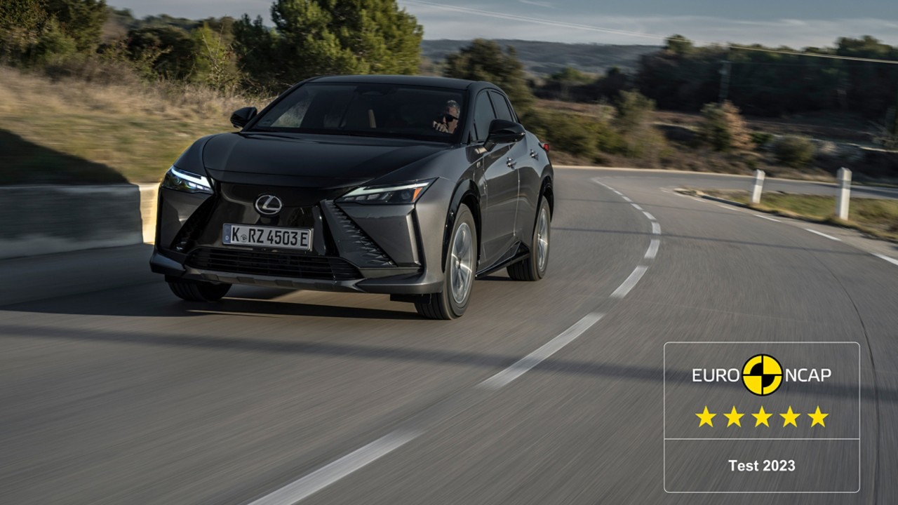 Lexus RZ driving in a rural location 