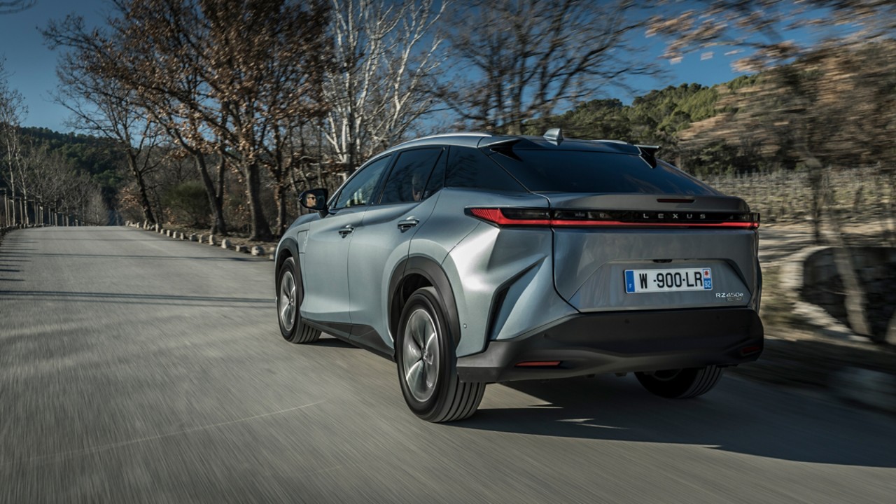 Rear view of a Lexus RZ 450e driving