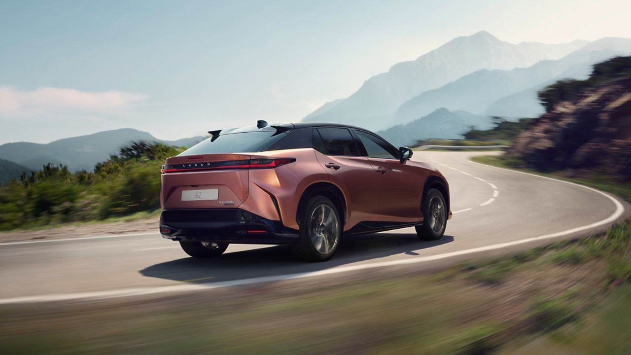 Lexus RZ driving on a mountainous road